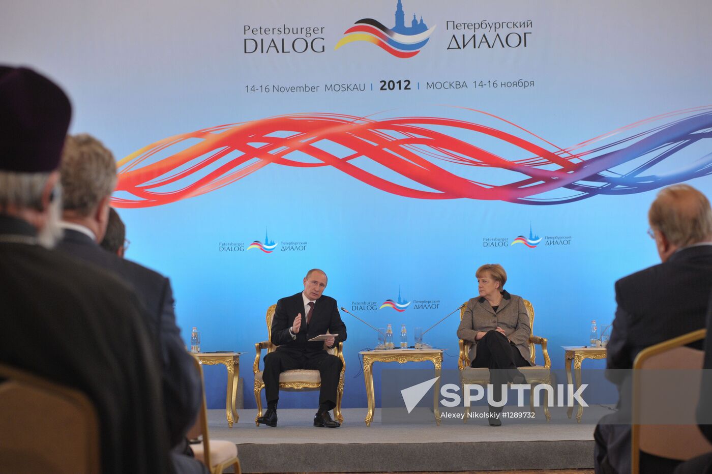 Vladimir Putin and Angela Merkel at 12th Petersburg Dialog