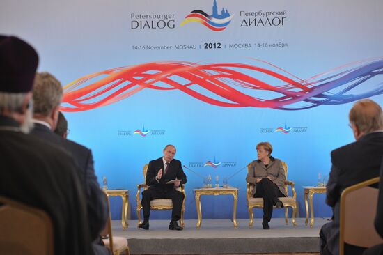 Vladimir Putin and Angela Merkel at 12th Petersburg Dialog