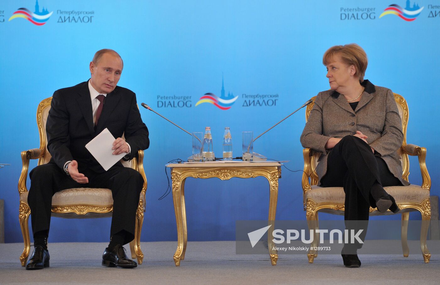 Vladimir Putin and Angela Merkel at 12th Petersburg Dialog