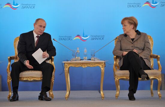 Vladimir Putin and Angela Merkel at 12th Petersburg Dialog