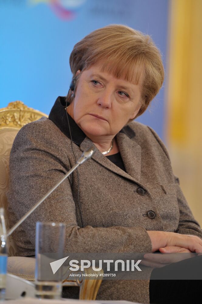Vladimir Putin and Angela Merkel at 12th Petersburg Dialog
