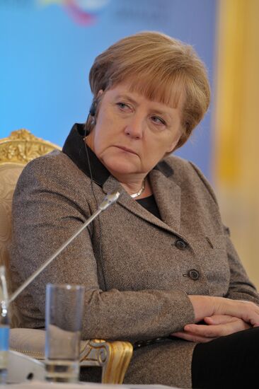 Vladimir Putin and Angela Merkel at 12th Petersburg Dialog