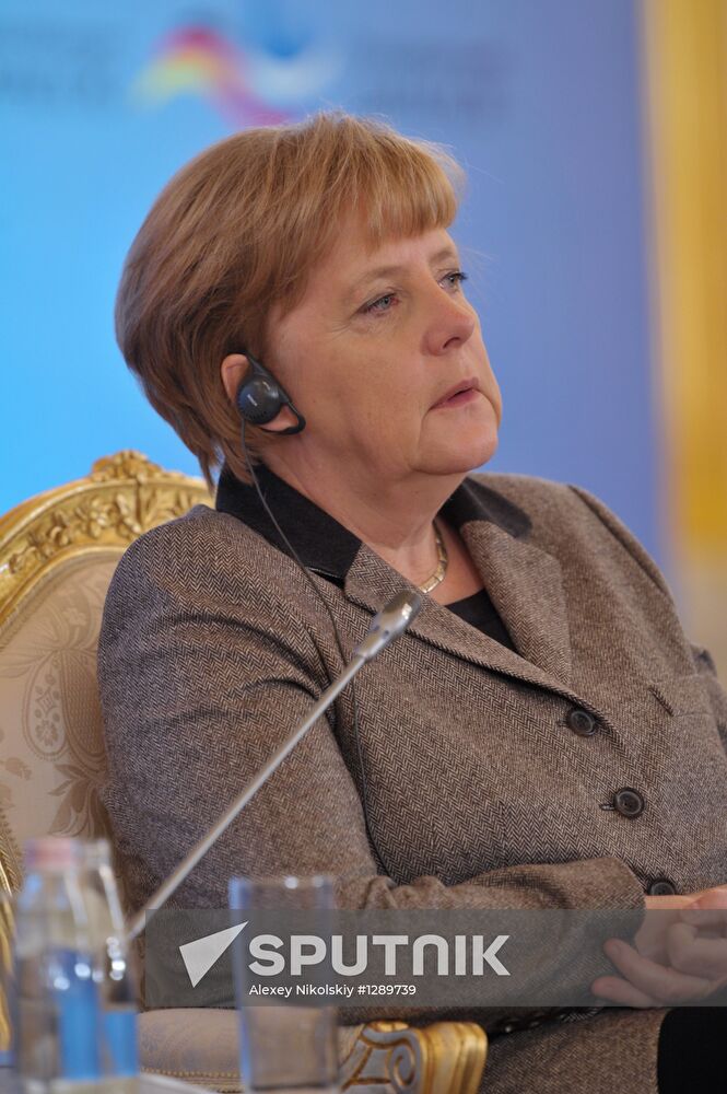 Vladimir Putin and Angela Merkel at 12th Petersburg Dialog