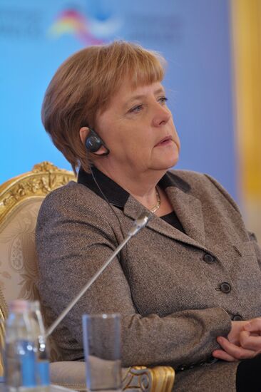 Vladimir Putin and Angela Merkel at 12th Petersburg Dialog