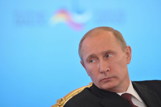 Vladimir Putin and Angela Merkel at St. Petersburg Dialog Forum