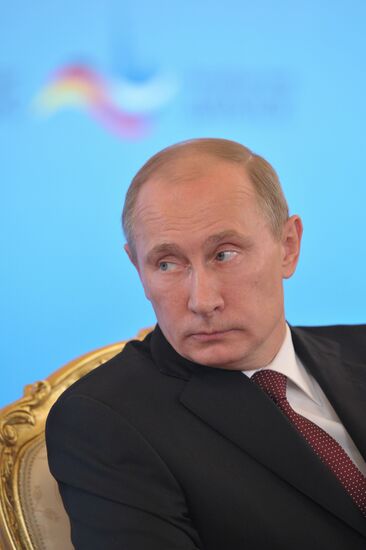 Vladimir Putin and Angela Merkel at St. Petersburg Dialog Forum