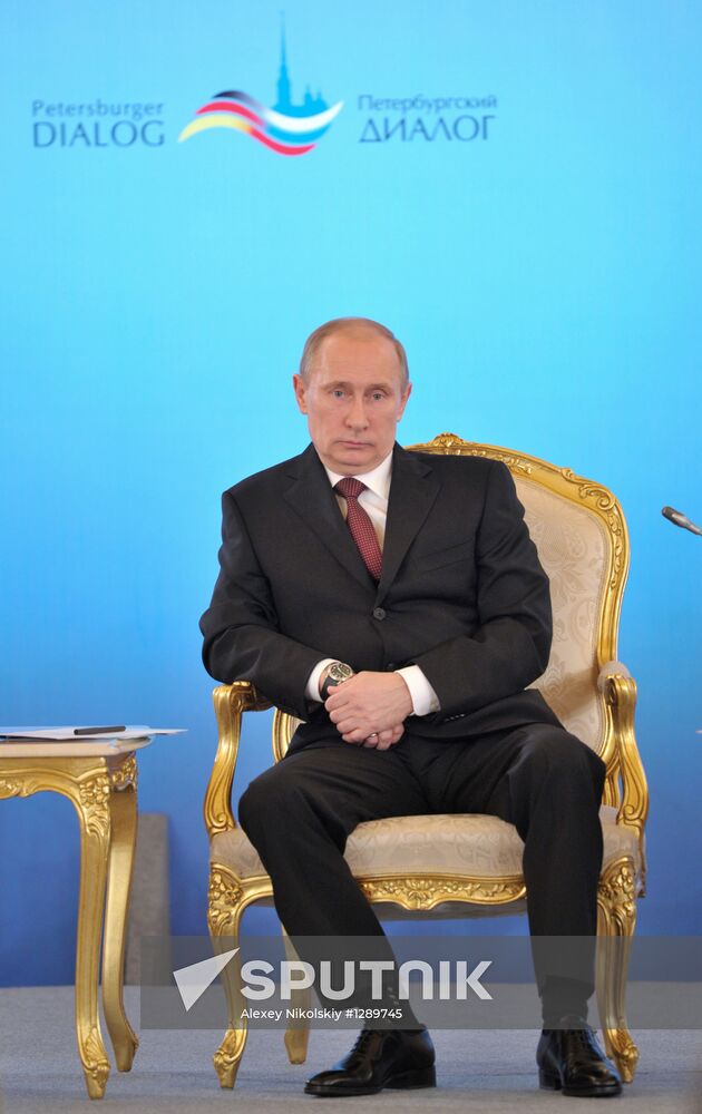 Vladimir Putin and Angela Merkel at 12th Petersburg Dialog