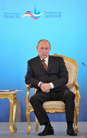 Vladimir Putin and Angela Merkel at 12th Petersburg Dialog