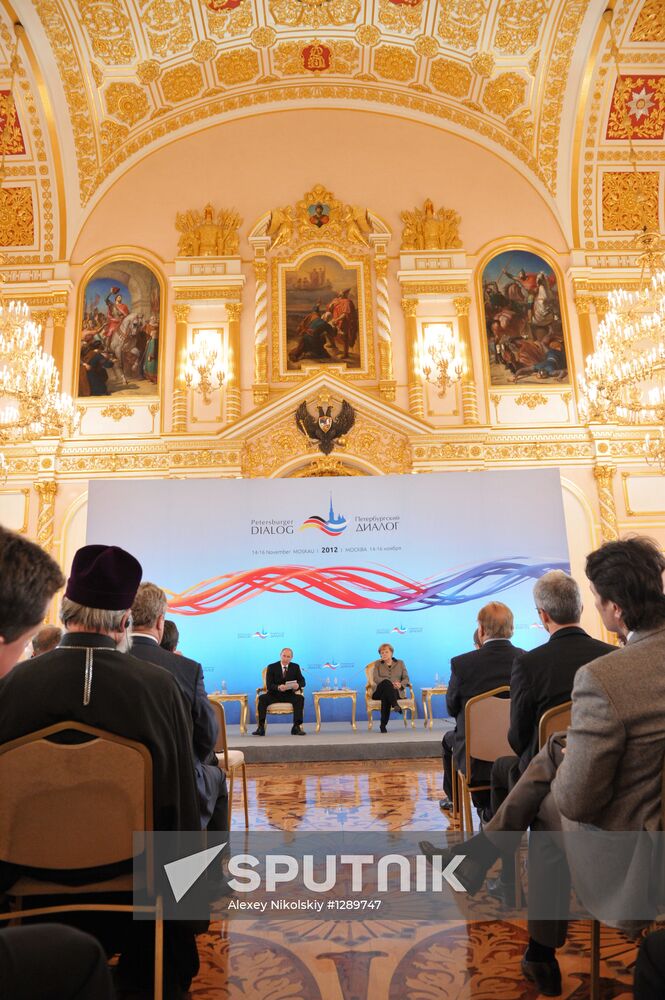 Vladimir Putin and Angela Merkel at 12th Petersburg Dialog