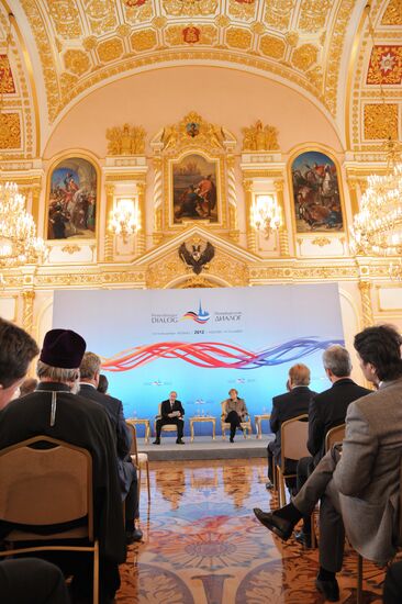 Vladimir Putin and Angela Merkel at 12th Petersburg Dialog