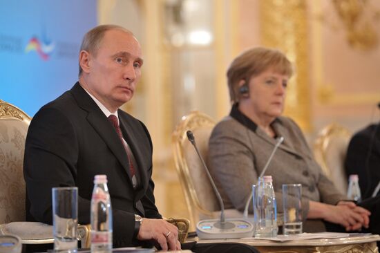 Vladimir Putin and Angela Merkel at 12th Petersburg Dialog