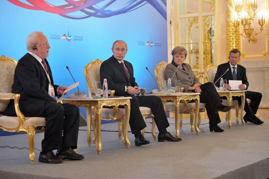 Vladimir Putin and Angela Merkel at 12th Petersburg Dialog