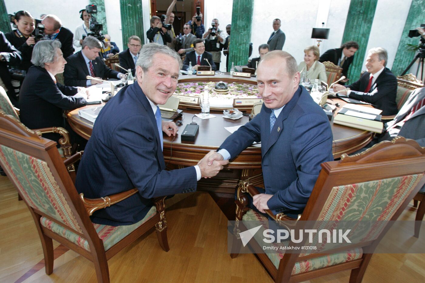 FIRST WORKING MEETING OF G8 LEADERS