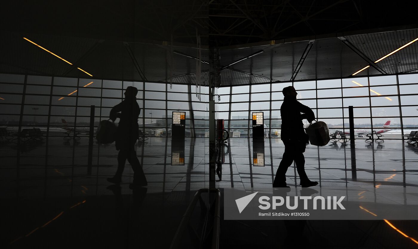 Passengers in waiting area of Vnukovo Airport