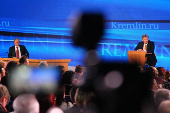 Vladimir Putin gives news conference