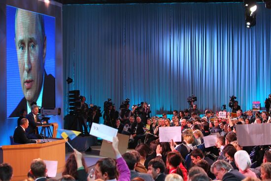 Vladimir Putin gives news conference