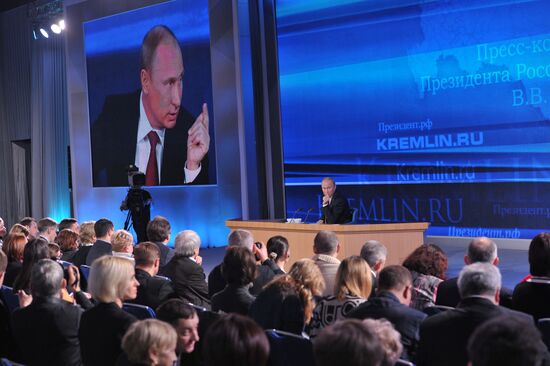 Vladimir Putin gives news conference