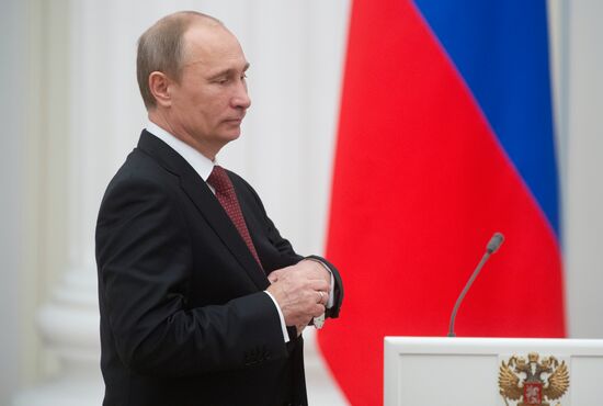 President Vladimir Putin presents state awards at the Kremlin