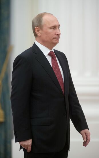President Vladimir Putin presents state awards at the Kremlin