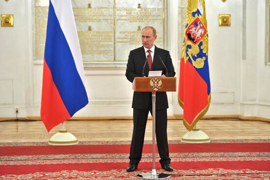 Vladimir Putin meets with senior officers in the Kremlin