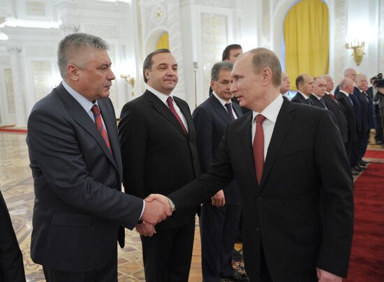 Vladimir Putin meets with senior officers in the Kremlin