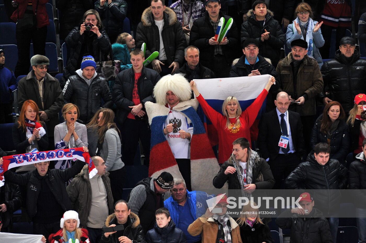 Russian team supporters cheer for their team in the quarterfinal match of the youth World Hockey Championship between the national teams of Russia and Switzerland. Location: Russia, Republic of Bashkortostan, Ufa. Author: Alexey Kudenko/Sputnik. Hockey Youth World Championship. Quarterfinal Russia-Switzerland