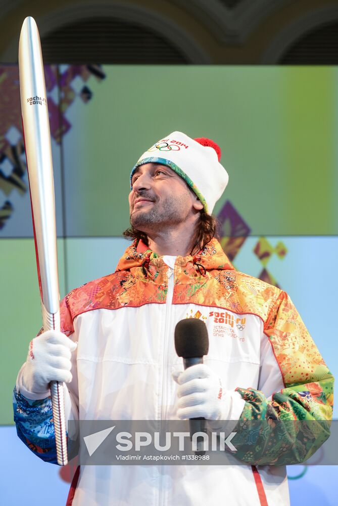 Olympic Flame Relay torch and uniform presented