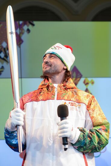 Olympic Flame Relay torch and uniform presented