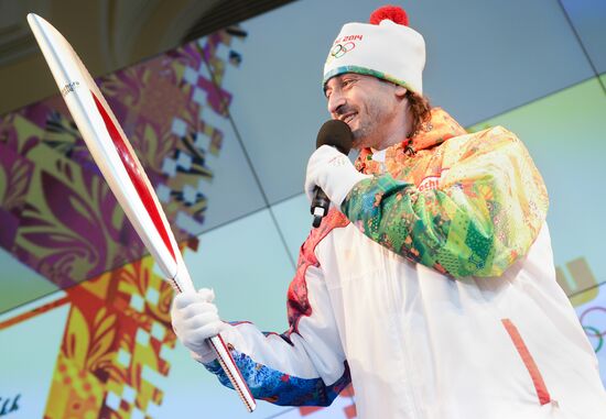 Olympic Flame Relay torch and uniform presented