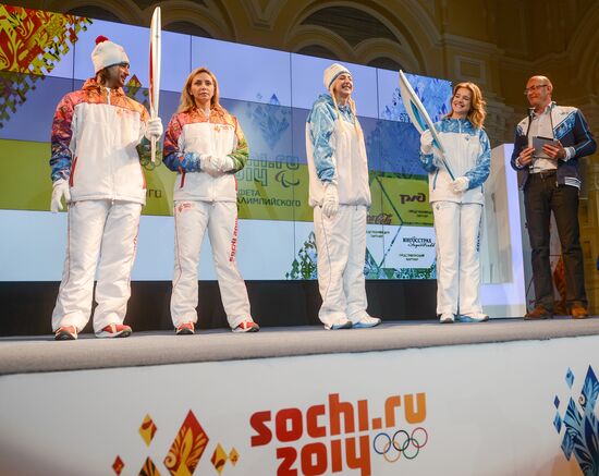 Olympic Flame Relay torch and uniform presented