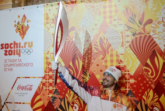 Olympic Flame Relay torch and uniform presented