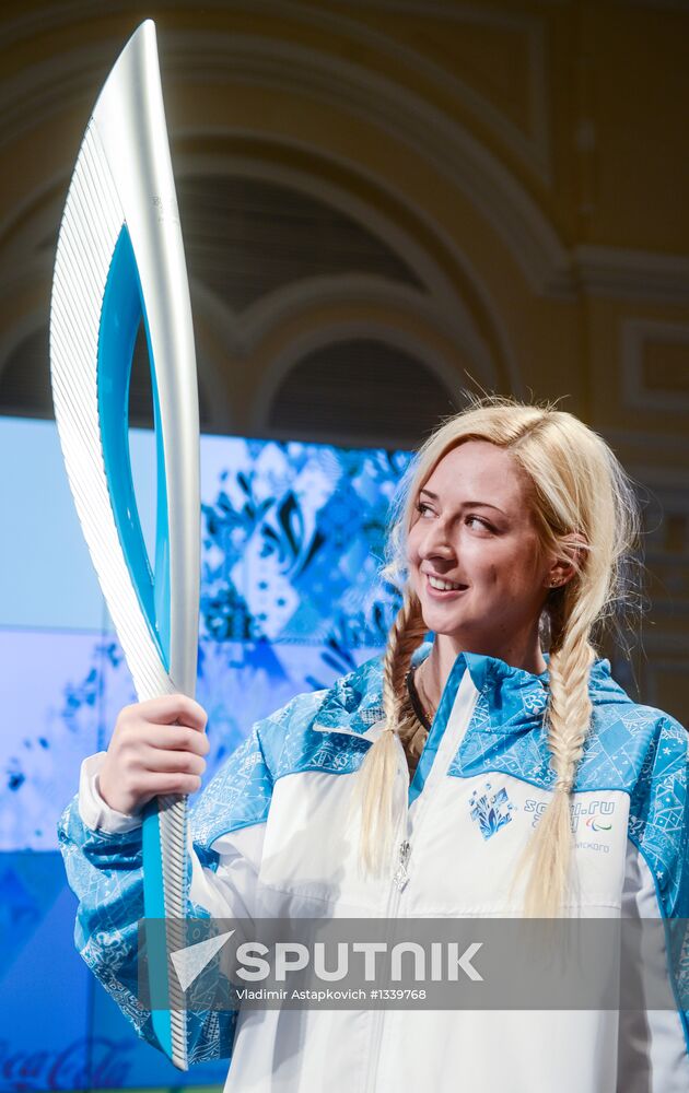 Olympic Flame Relay torch and uniform presented
