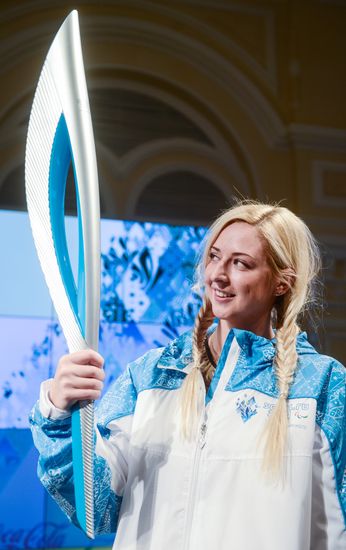 Olympic Flame Relay torch and uniform presented