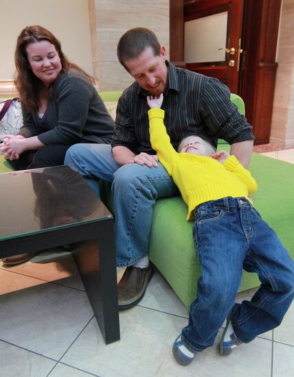 American family receive documents for adoption