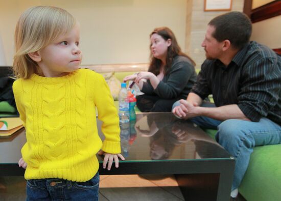 American family receive documents for adoption