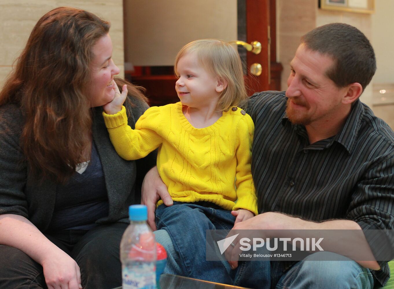 American family receive documents for adoption