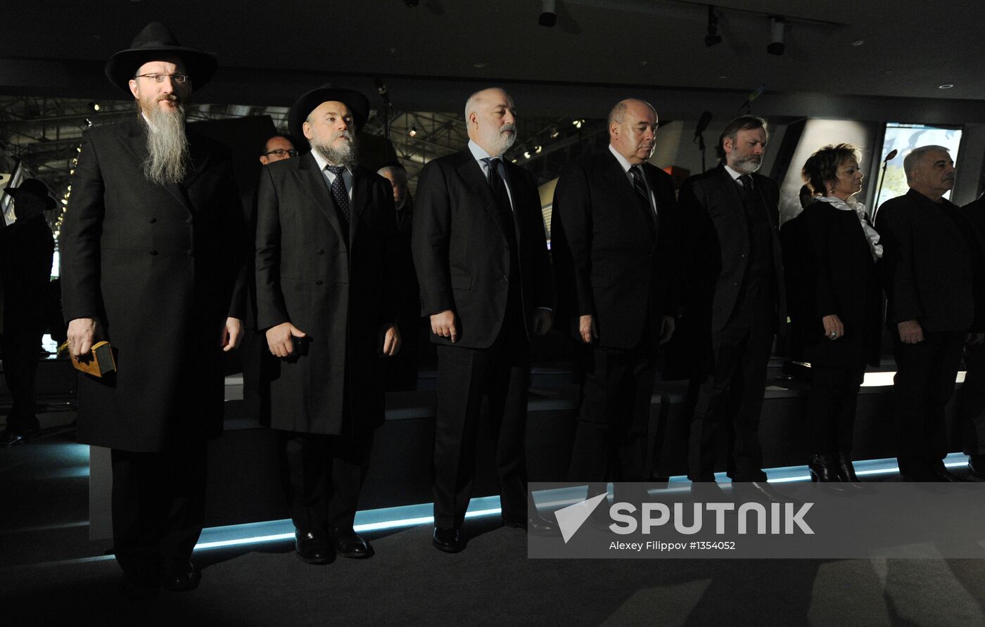 Lighting candles in memory of Holocaust victims