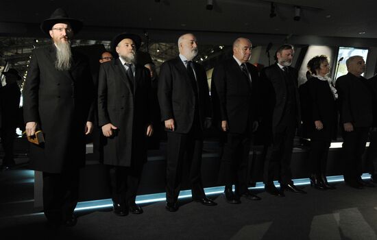 Lighting candles in memory of Holocaust victims