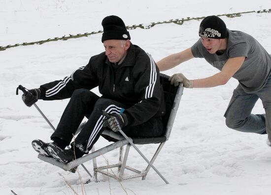 Disabled people training on the sit ski