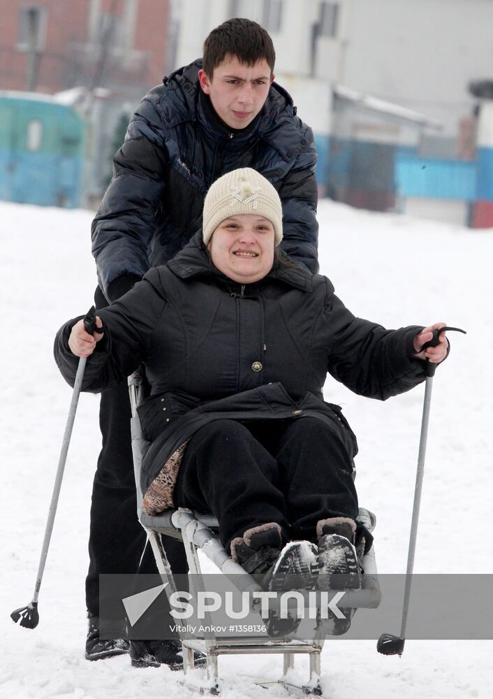 Disabled people training on the sit ski