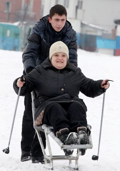 Disabled people training on the sit ski