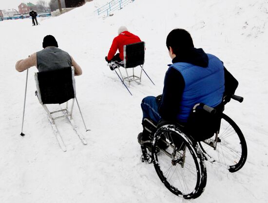 Disabled people training on the sit ski