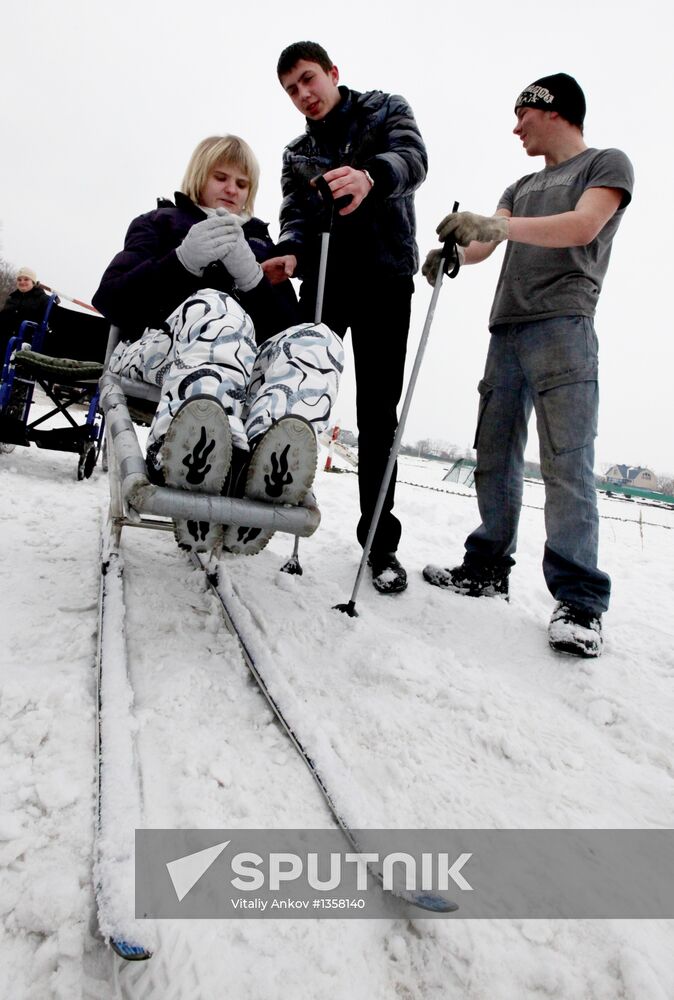 Disabled people training on the sit ski