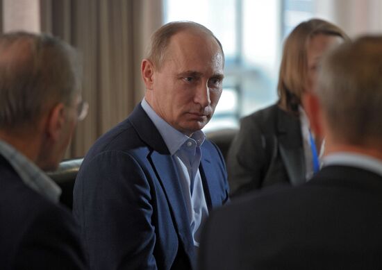 Vladimir Putin visits mountain-based Olympic facilities in Sochi