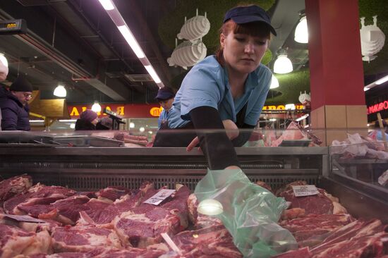 Selling meat at markets