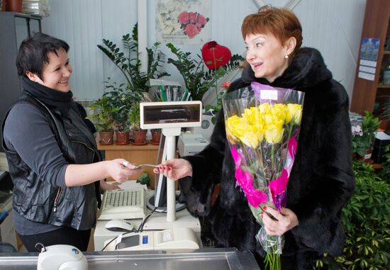 Growing flowers in greenhouse facility in Tomsk