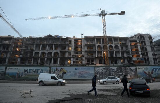 Workers at construction site of Gorki Gorod Olympic facility