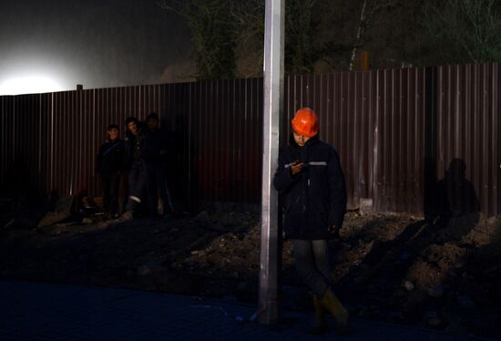 Workers at construction site of Gorki Gorod Olympic facility