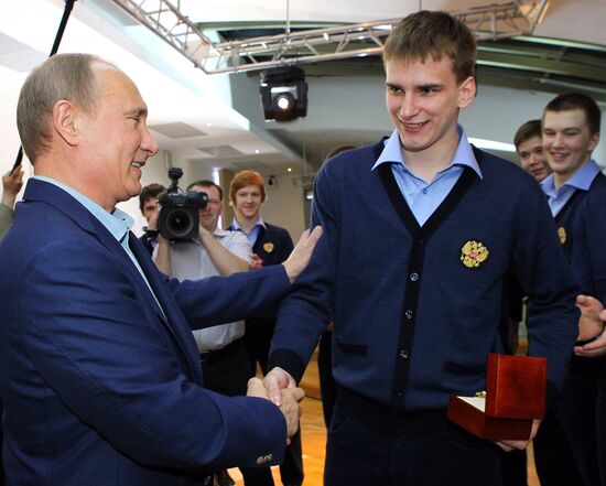 Vladimir Putin attends screening of film Legend No. 17