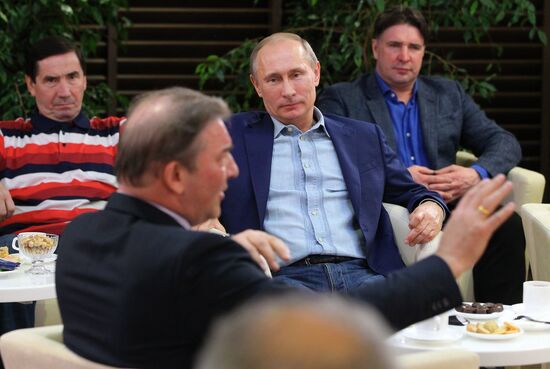 Vladimir Putin attends screening of film Legend No. 17